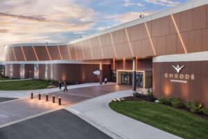 Shkodé logo above channel letters with a halo effect at Gun Lake Casino