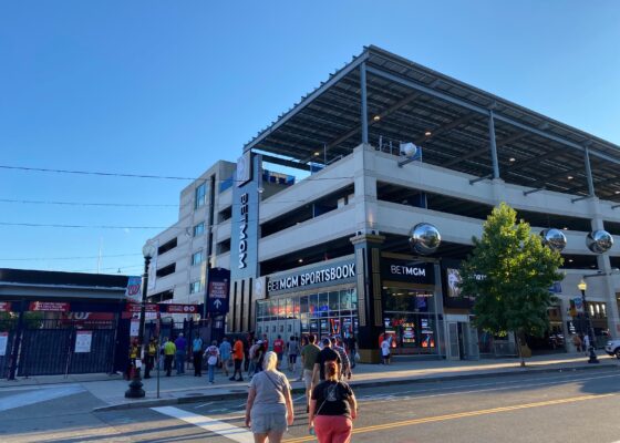 Exterior brand identity signs, digital displays, and architectural elements at the BetMGM Sportsbook at Nationals Park